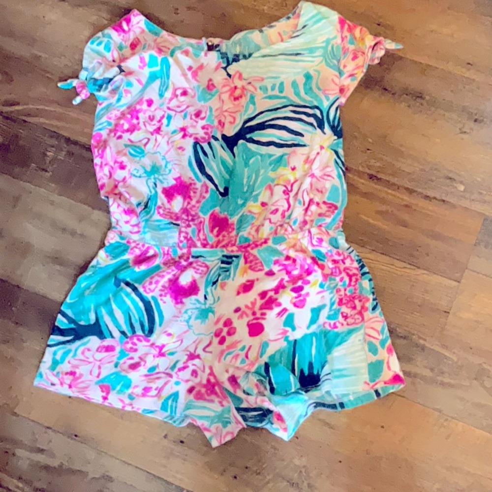 This blue and Pink Lily Pulitzer romper is a size 10 in kids.